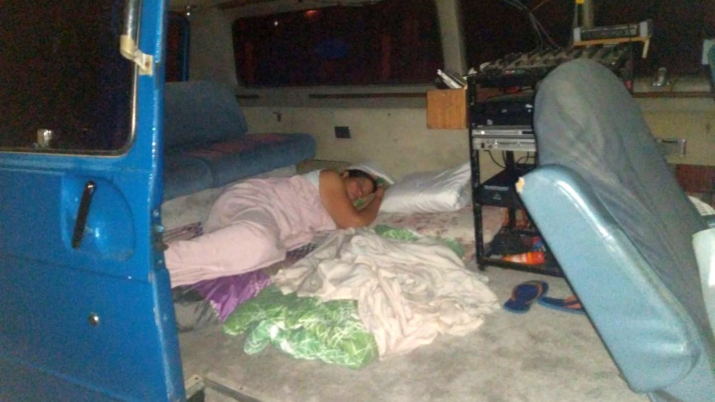 Earthquake evacuee sleeping in van